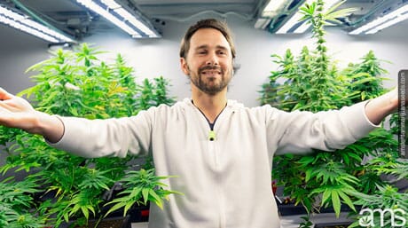 man in his grow space