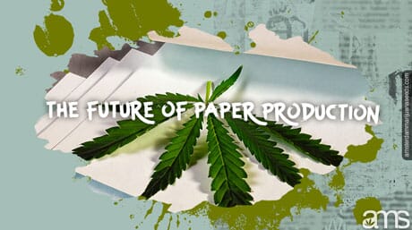 marijuana leaf on top of reams of hemp paper