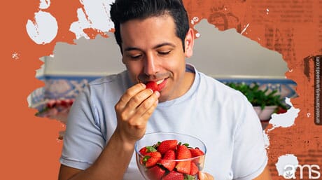 man eats CBD-infused strawberries