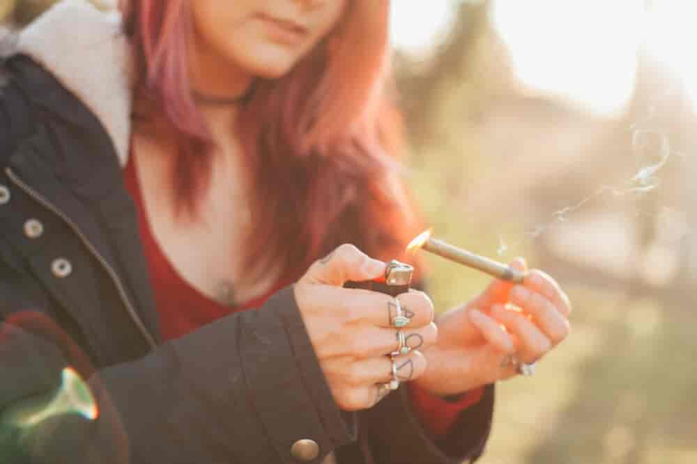 Woman litting her joint