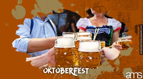 friends toast with beer mugs at Oktoberfest
